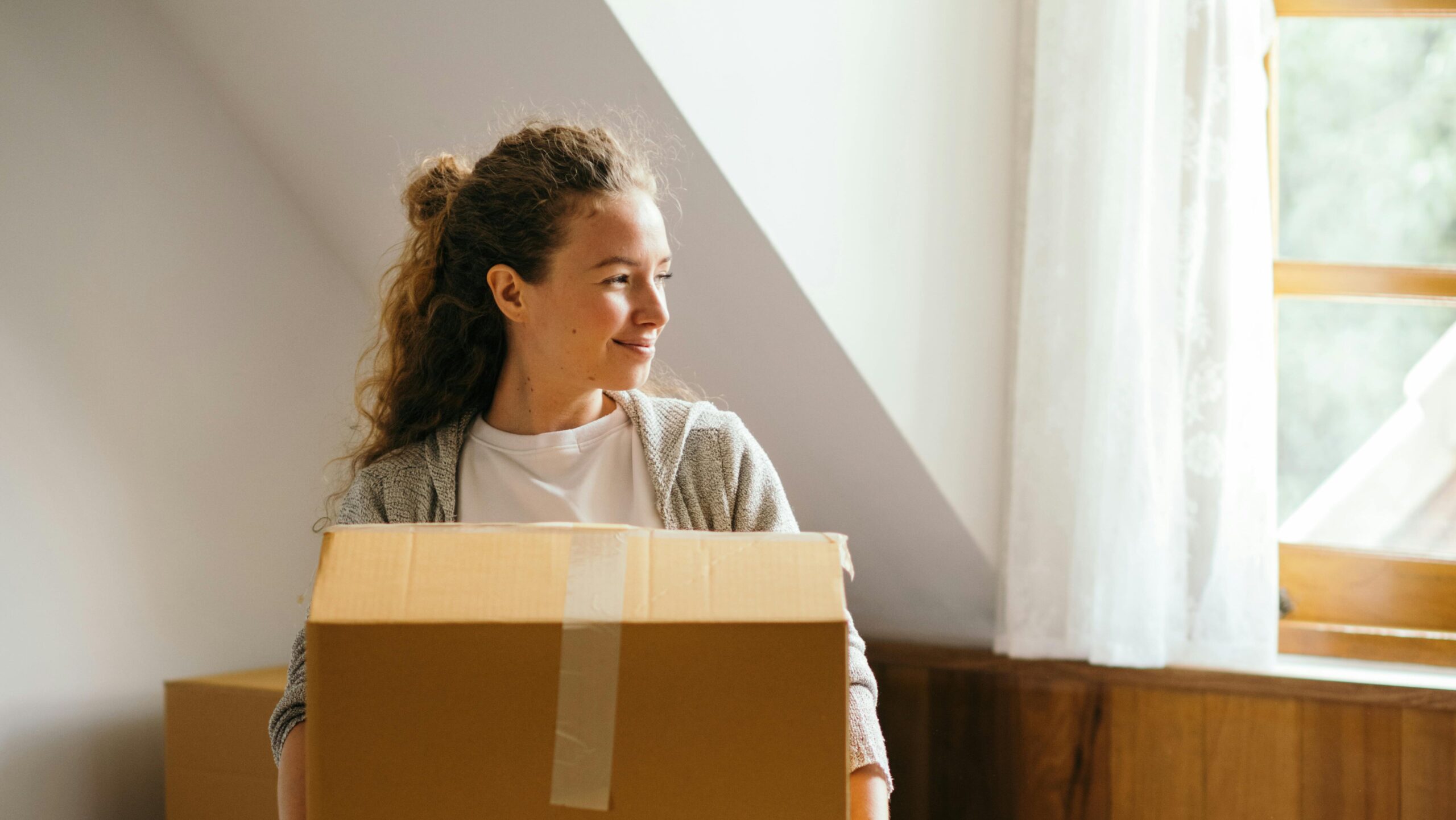 A woman moving into her first married housing in Rexburg Idaho